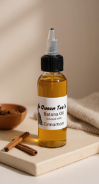 Queen Tee's Premium Batana Oil infused with Cinnamon in a 2 oz bottle, showcasing natural herbal oil with cinnamon accents.