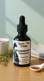 Queen Tee's Wormwood Herbal Parasite Cleanser tincture bottle with label and dropper for natural parasite detox treatment.