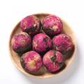 Queen Tee's Organic Dried Rose Blooming Tea Ball, loose herbal tea with natural rose blossoms in a decorative tea ball.
