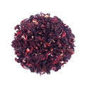 Loose leaf Hibiscus tea by Queen Tee’s Herbal Teas and Tinctures, vibrant red dried hibiscus flowers in a clear jar.
