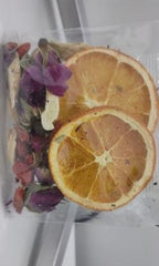 Queen Tee's herbal loose tea with peppermint and lime slices, premium freeze-dried fruit tea from Queen Tee's Herbal Teas and Tinctures.