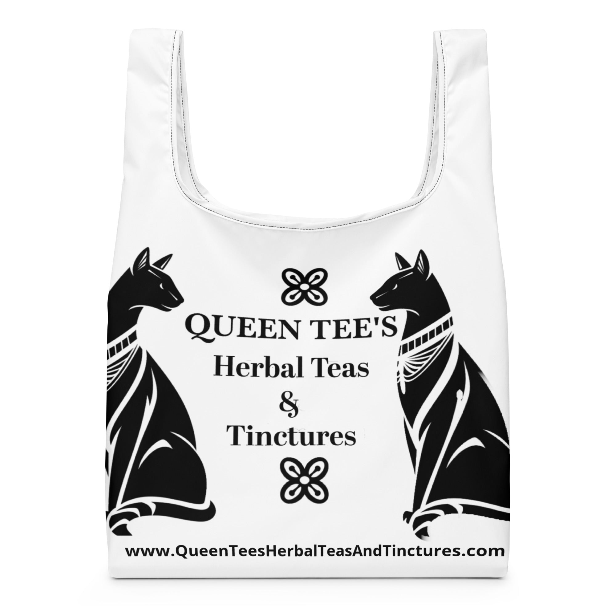 Black Queen Tee's Herbal Teas and Tinctures shopping bag with all-over herbal print, durable fabric, and spacious design.