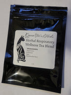 Loose herbal tea blend in a jar labeled Queen Tee's Premium Respiratory Wellness Tea, featuring dried herbs and natural ingredients.