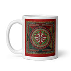 White glossy mug featuring Sri Yantra Mandala design, 11 oz size with handle on the left, by Queen Tee's Herbal Teas and Tinctures.