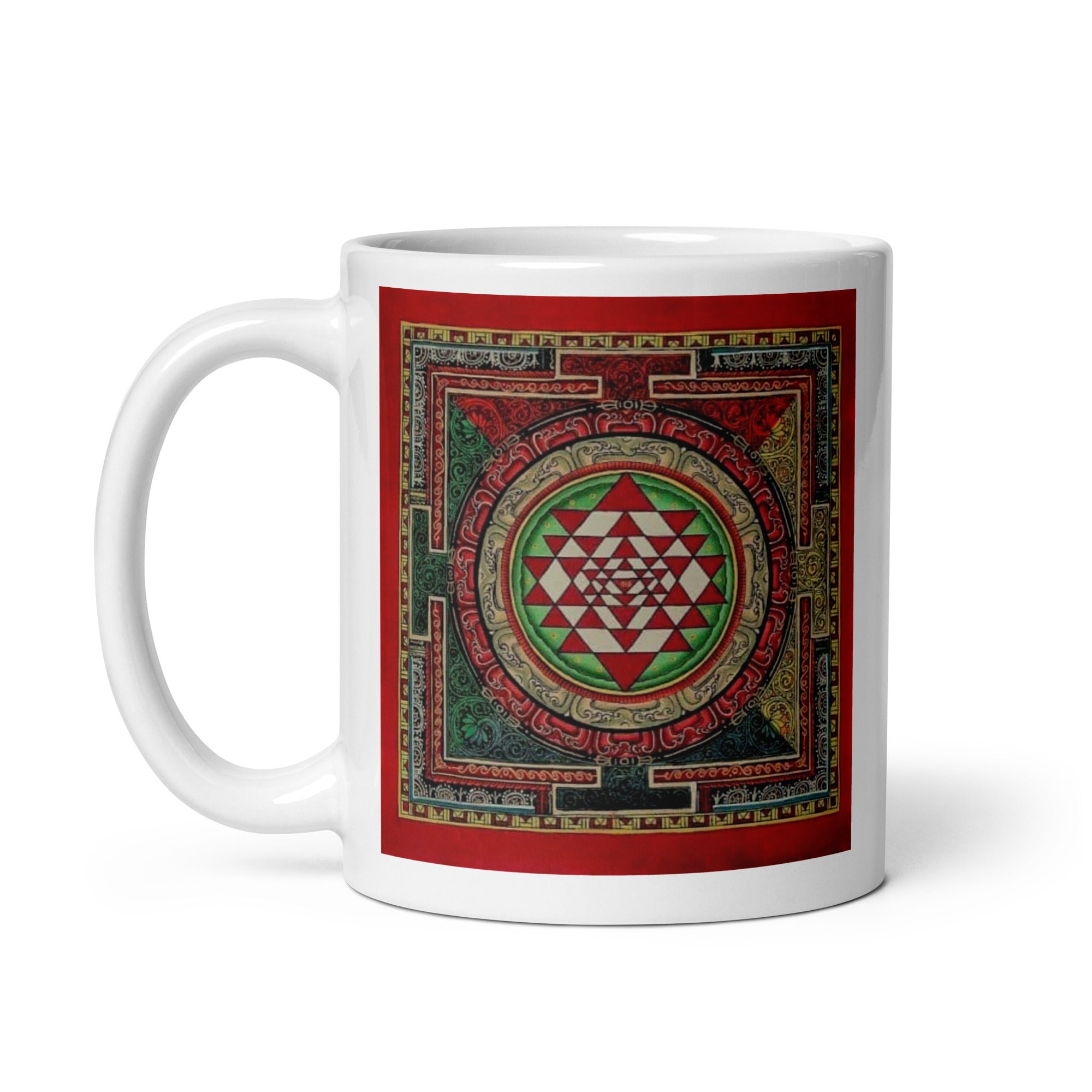 White glossy mug featuring Sri Yantra Mandala design, 11 oz size with handle on the left, by Queen Tee's Herbal Teas and Tinctures.