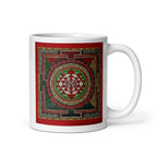 White glossy 11 oz Sri Yantra Mandala mug with handle on the right, featuring intricate sacred geometric design.