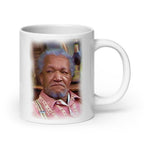 White 20 oz Fred Sanford mug with handle on the right, glossy finish, made by Queen Tee's Herbal Teas and Tinctures.